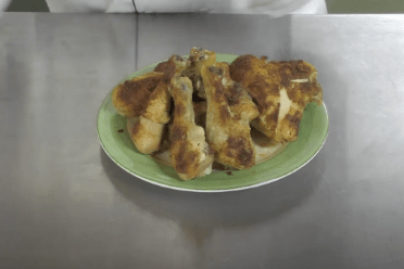 Green plate of chicken